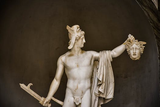 Marble statue of Perseus with Medusa's head in Vatican City, neoclassical style.