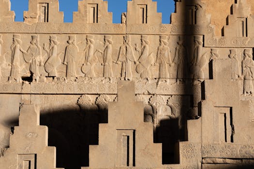 Detailed stone carvings of ancient figures at Persepolis, Iran.